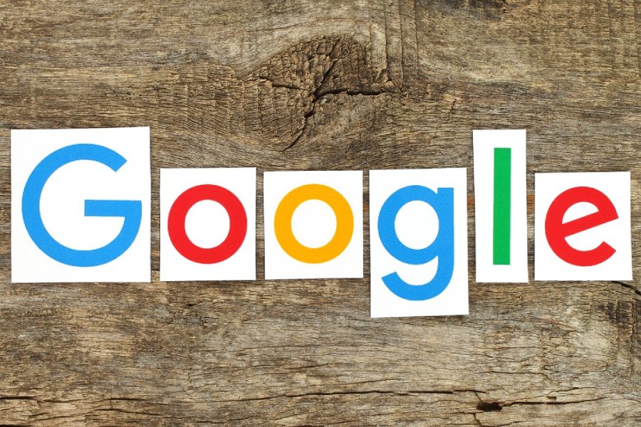 Google logo on a wood background