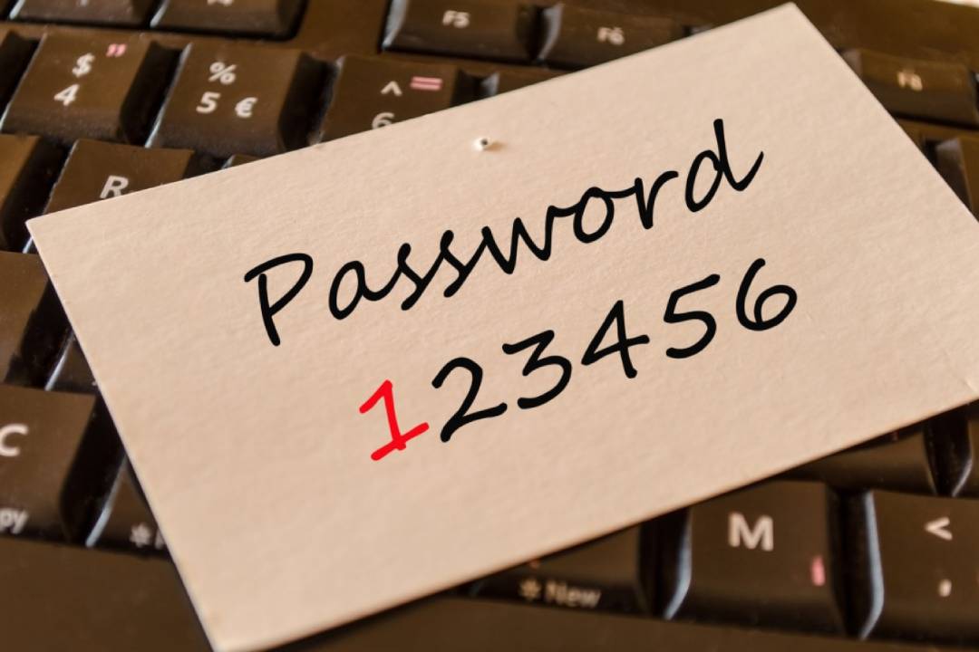 Note on a keyboard with the text "Password 123456"