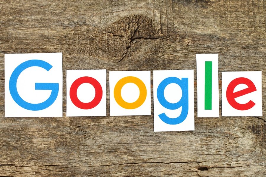Google logo on a wood background