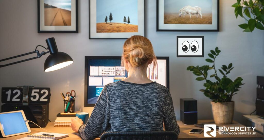 Employee working in a home office surviving a phishing attack